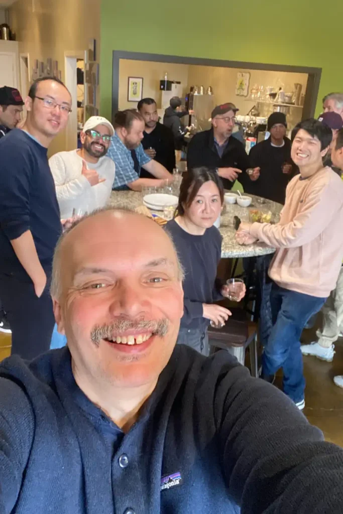 a group of people around a table attending a coffee tasting event