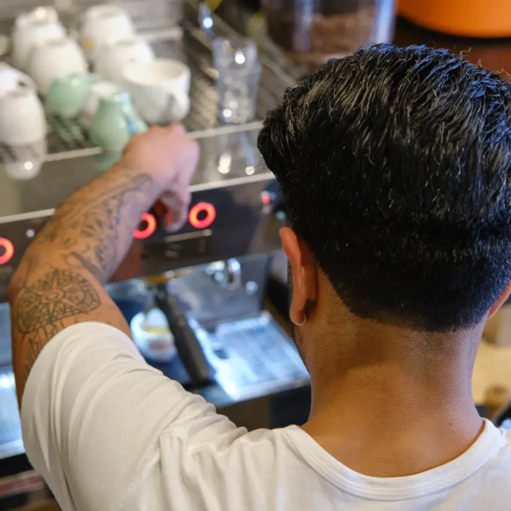 ai proof job barista pulling a shot on la marzocco