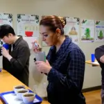 Students tasting coffee via cupping